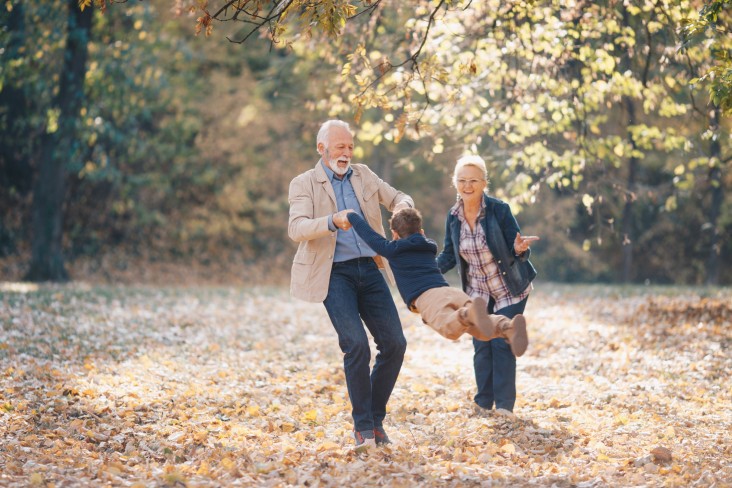 Grandparents play with grandchild