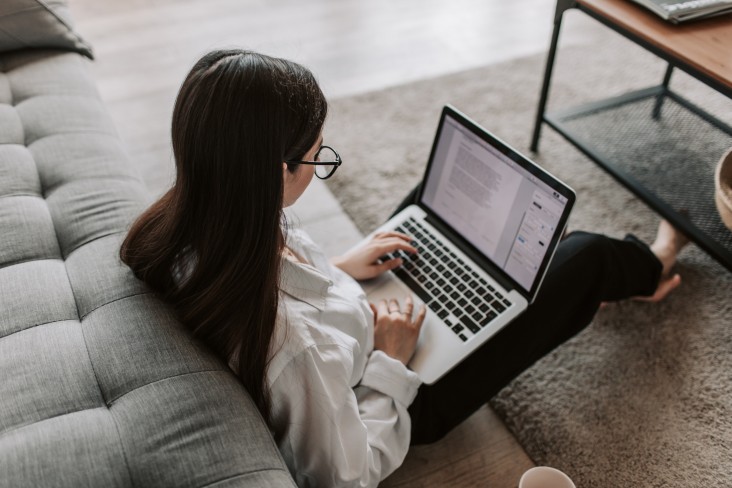 Woman works on document at home