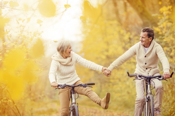 Older couple on bikes