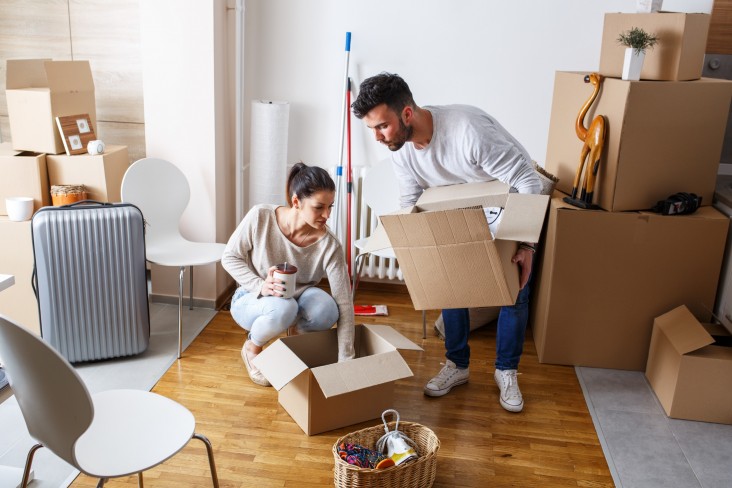 Man and woman unpacking boxes