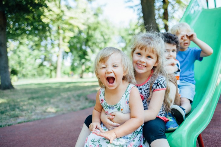 Children playing on slide