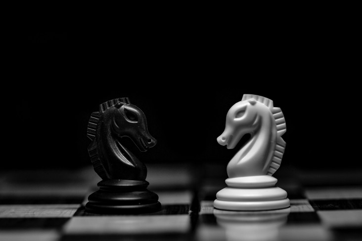 chess pieces face to face
