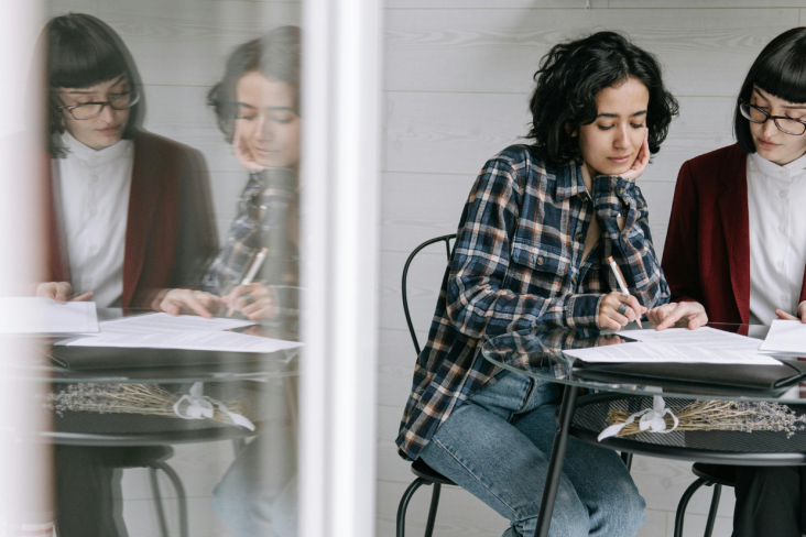 Two woman discussing documents