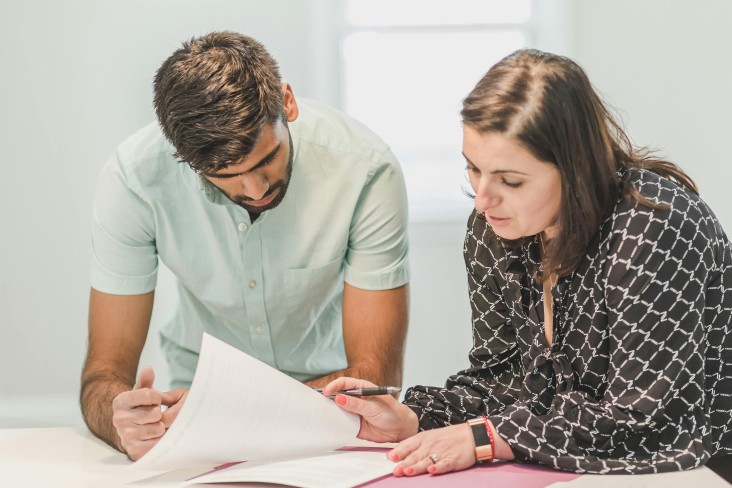 Two people reviewing paperwork